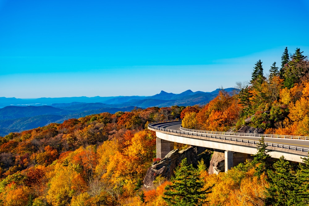 View of the Linn Cove Viaduct in all the glory of Blue Ridge Parkway fall colors - something you can easily enjoy from our Shenandoah Valley cabins